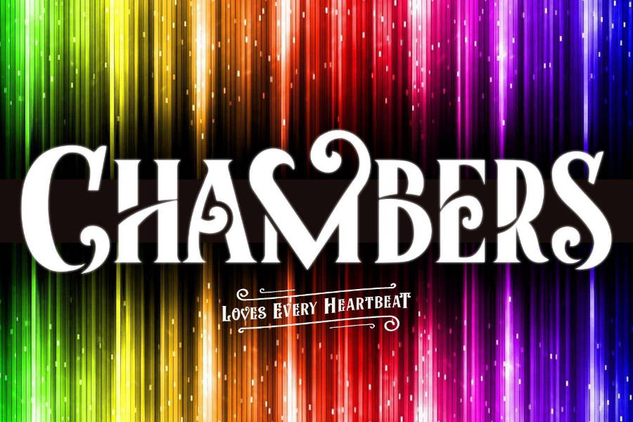 White “CHAMBERS” text in large stylized font over a vertical rainbow light streak background.