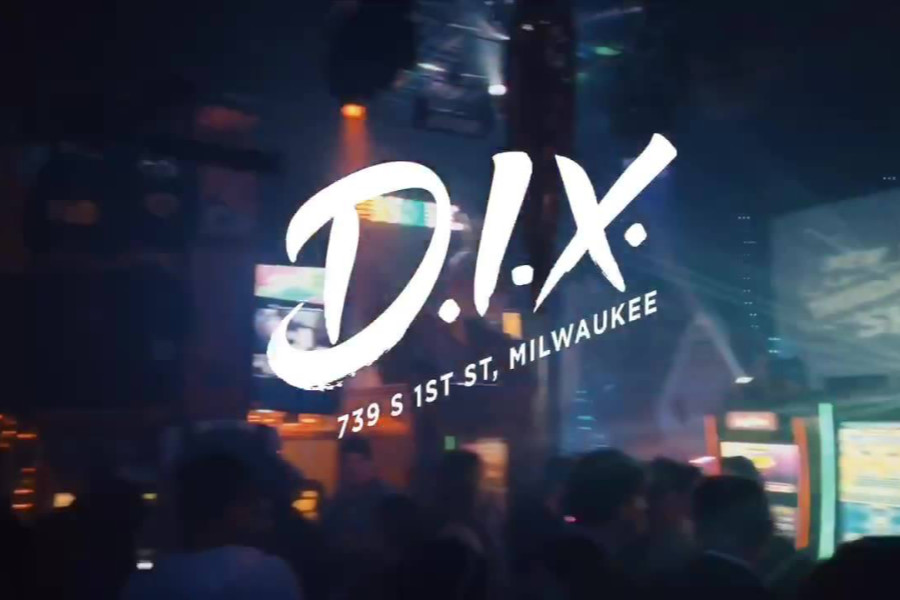 Nightclub crowd scene with bright lights and D.I.X. Milwaukee logo and address in white text.