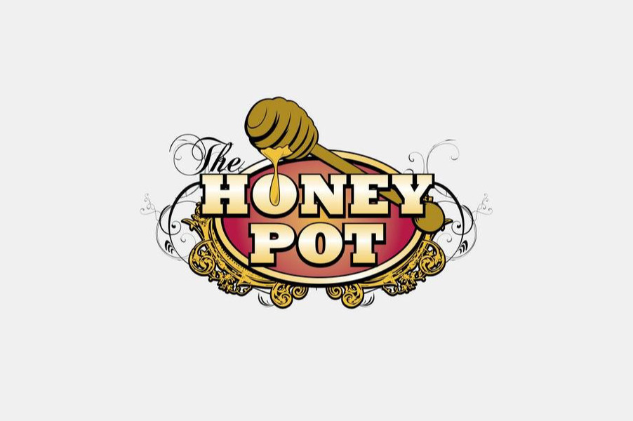 Stylized Honey Pot logo with pink and gold tones and a honey stick dripping into an emblem.