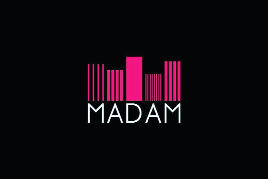 Logo of Le Madam Club in Paris with vertical pink bars and “MADAM” in white text.