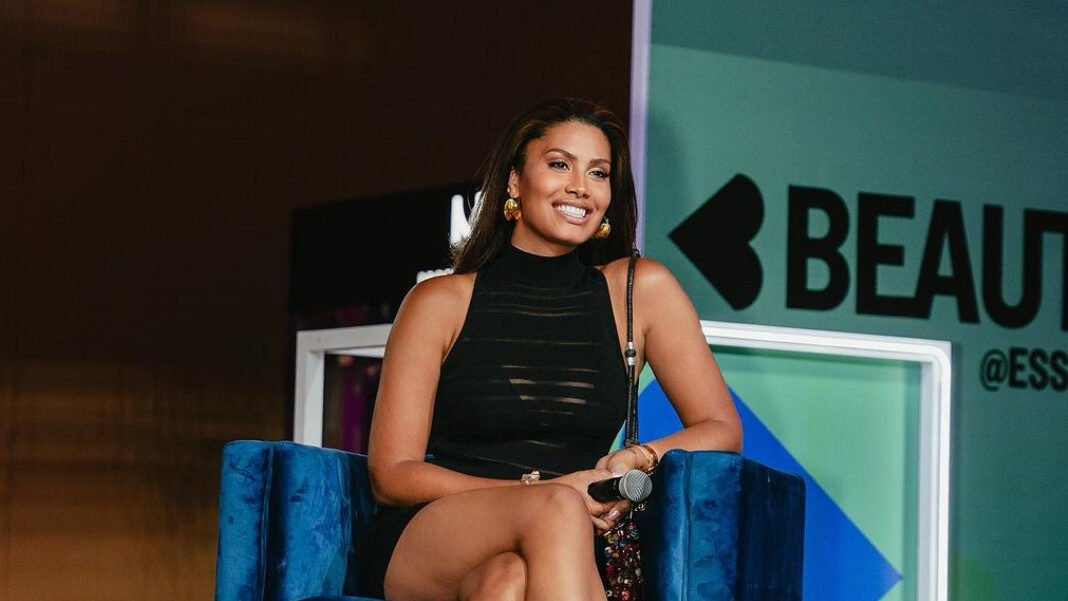 Leyna Bloom seated onstage at Essence Festival 2023 during the Beautycon panel about fashion and diversity.
