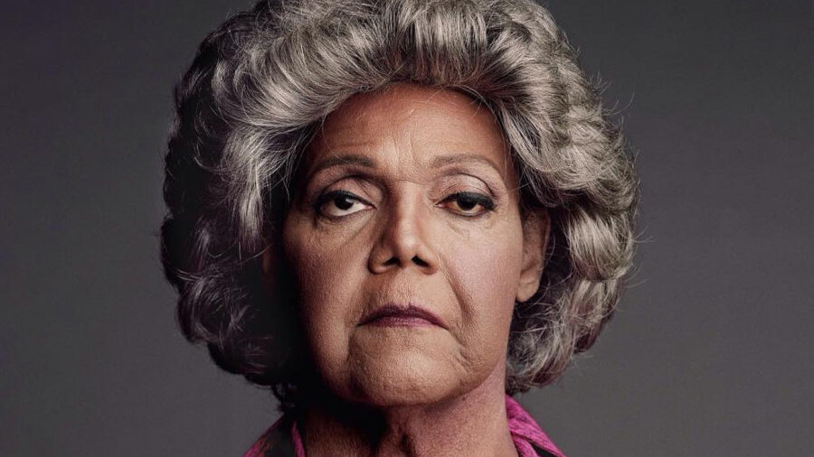 Close-up of Miss Major Griffin-Gracy in a pink zip-up top, looking serious, taken for HBO’s The Trans List in.