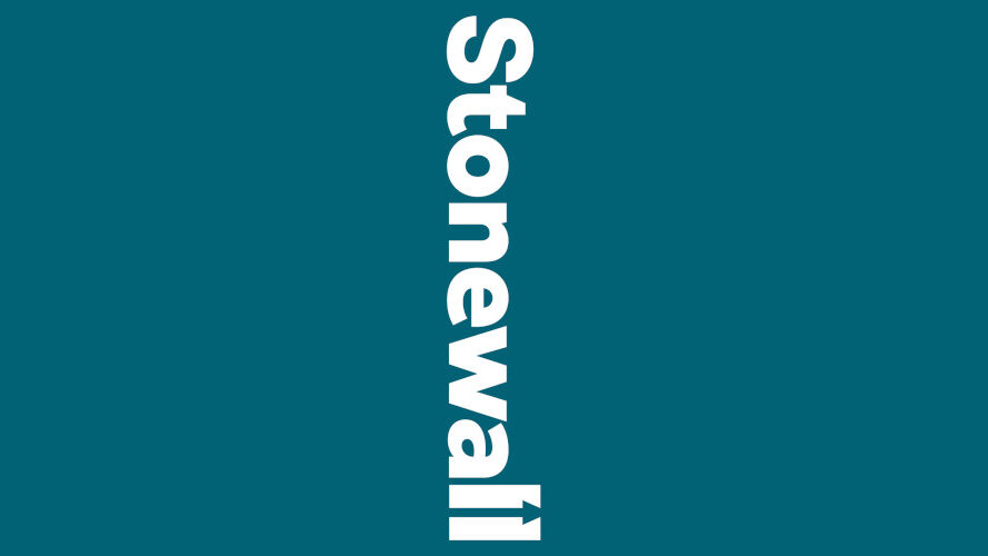 Stonewall logo in bold white text set vertically on a teal background, ending in an arrow pointing upward.