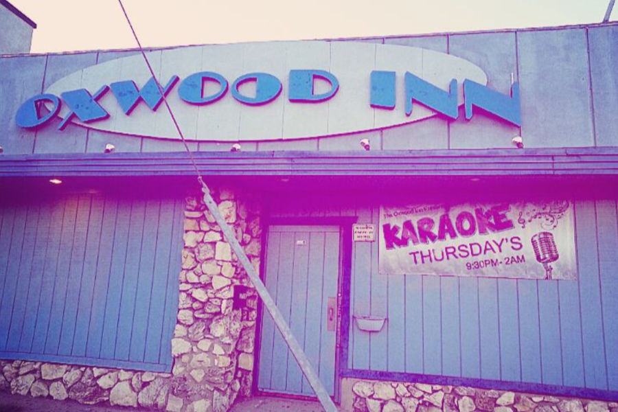 The front of Oxwood Inn bar in Canoga Park with a karaoke banner.