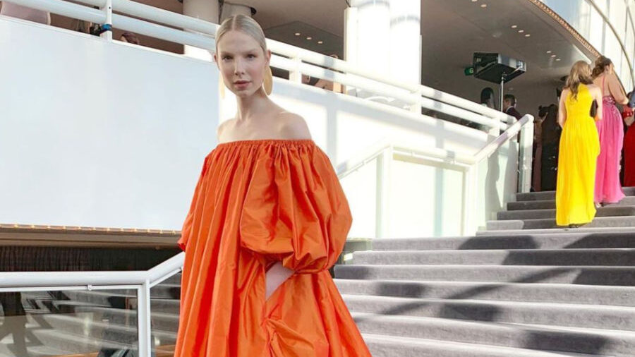 Valentijn de Hingh in a long orange off-shoulder gown at the Dutch Opera & Ballet gala on June 28, 2019, in Amsterdam.