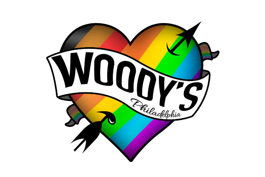 Heart-shaped rainbow logo with the text “Woody’s Philadelphia” and two arrows crossing it.